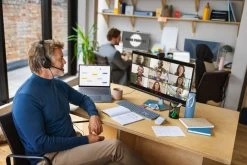 Jabra Evolve2 50 Corded USB Headset -Cheap Headphones Store jabra evolve2 50 male working at desk listening boom arm up 2 medium 2